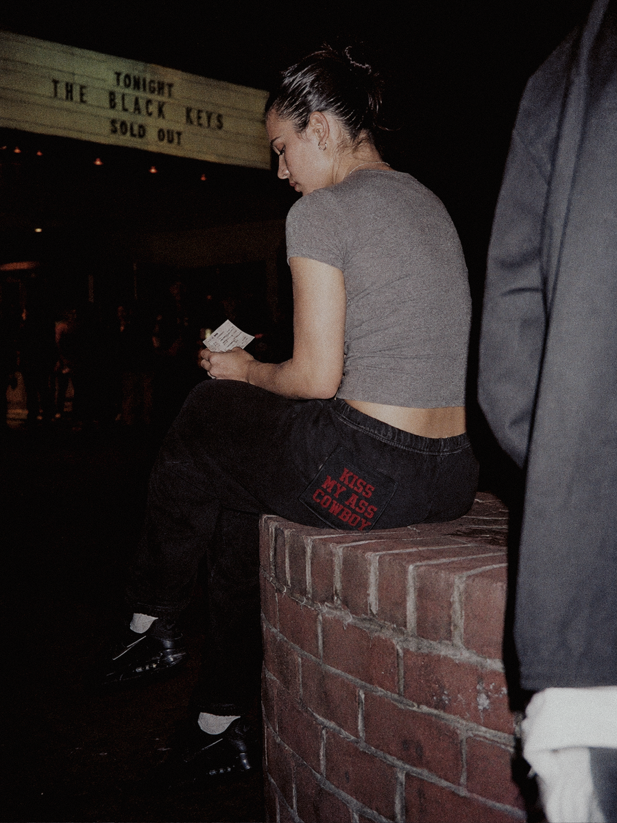 Kiss My Ass Cowboy Sweatpants styled on a model