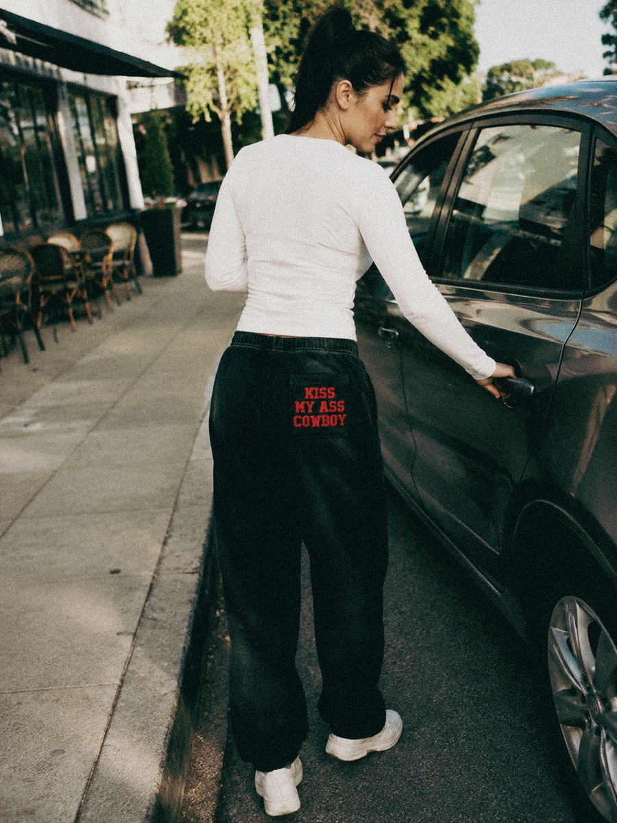 Kiss My Ass Cowboy Sweatpants styled on a model