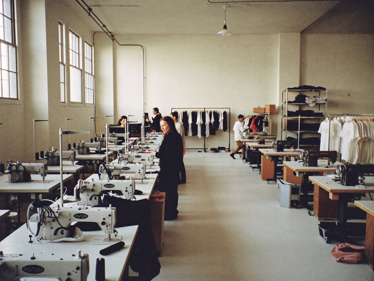 Maverick workshop, sewing machines and racks of finished pieces
